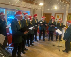 Members of u3a singing Christmas carols.